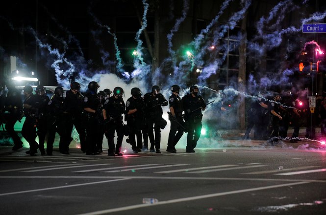 Flares go off near police during a protest in Rochester, New York, on Sept. 4, 2020.