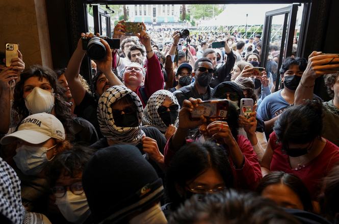 Pro-Palestinian protesters in Butler Library at Columbia University in New York, New York, on May 7, 2025. The next day, four student journalists were temporarily suspended for their coverage of the demonstration.