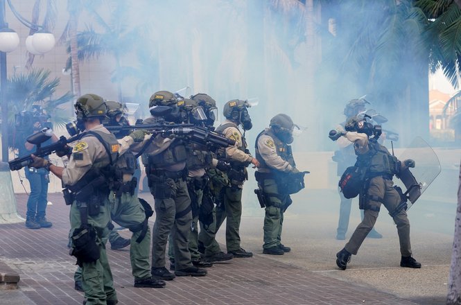 Los Angeles County sheriff’s deputies deploy tear gas at a “No Kings” protest on June 14, 2025, in Los Angeles, California.