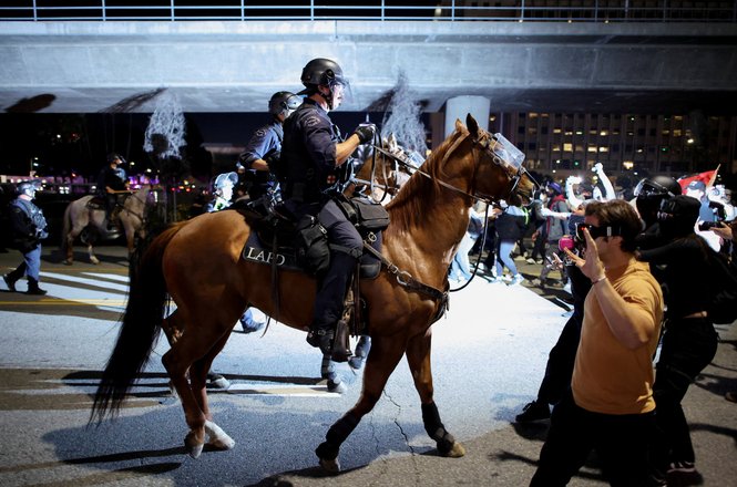 Mounted police clash with protesters at a “No Kings” rally against the Trump administration in Los Angeles, California, on Oct. 18, 2025.