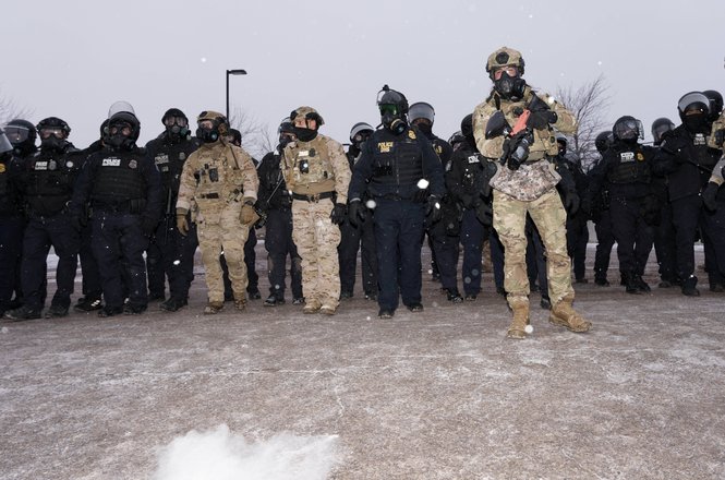 A federal agent shoots pepper balls at the ground in front of freelance photojournalist Tim Evans while he was covering anti-deportation protests for Reuters outside the Whipple Federal Building in Fort Snelling, Minnesota, on Jan. 16, 2026.