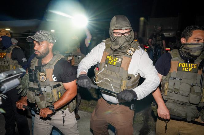 Federal officers hold batons outside an immigration detention facility in Newark, New Jersey, on May 27, 2026.