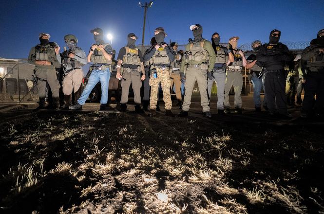 Federal agents at an immigration protest outside a detention facility in Newark, New Jersey, on May 28, 2026.
