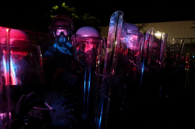 New Jersey State Police officers in riot gear outside an immigration detention center in Newark on May 30, 2026. Photojournalist Will Allen-DuPraw was targeted with crowd-control munitions while covering protests at the facility that night.