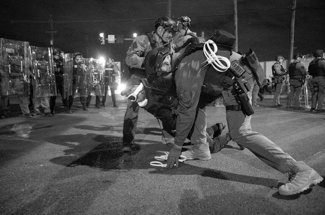 A protester being arrested by officers outside an immigration detention center in Newark, New Jersey, on May 31, 2026. Multiple journalists, including independent reporter Marcos Quinones, reported that officers shoved them that day.
