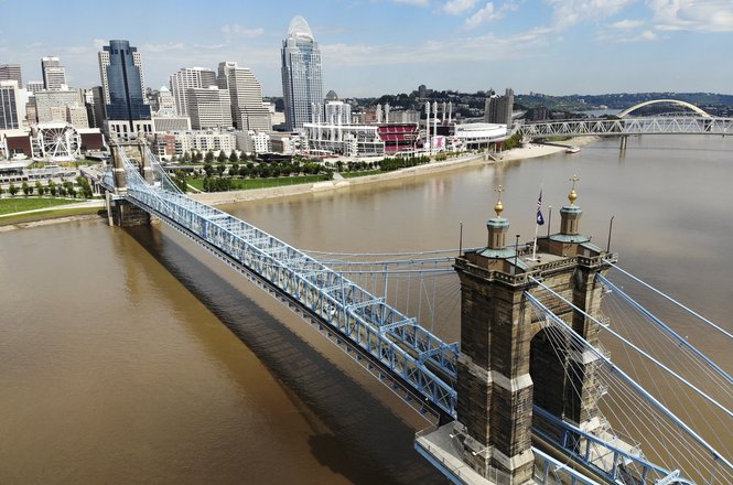 Anti-deportation protesters marched across the Roebling Suspension Bridge connecting Cincinnati, Ohio, and Covington, Kentucky, on July 17, 2025. Two CityBeat journalists were arrested by Covington police while covering the demonstration