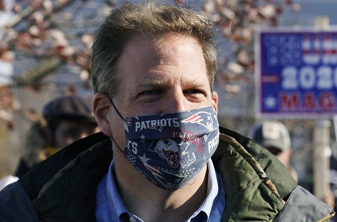 New Hampshire Gov. Chris Sununu wearing a protective mask at a polling station in Windham, New Hampshire, during the COVID-19 pandemic in November 2020