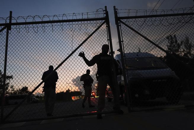 Officers at the entrance of the Krome immigration detention center in Miami, Florida, on May 24, 2025.