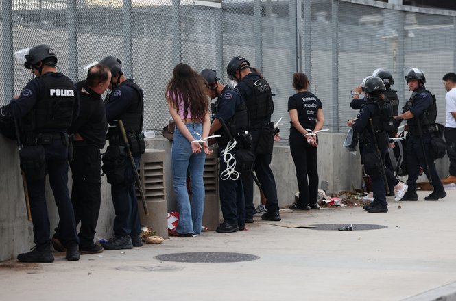 Police arrest protesters in downtown Los Angeles, California, after a “No Kings” rally on March 28, 2026