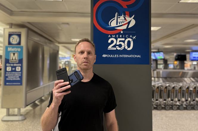 Journalist Max Blumenthal holds up his two cellphones, which were seized and searched by U.S. Customs and Border Protection at Dulles International Airport in Virginia on July 10, 2026.