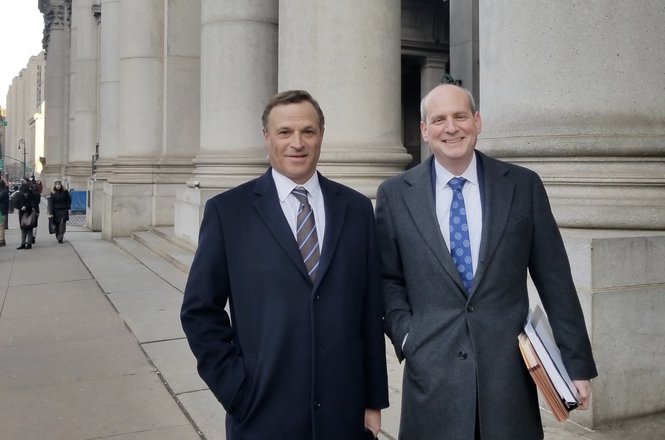 Attorneys Mark Bailen, left, and Peter Shapiro celebrate a favorable decision for their client, journalist Teri Buhl, who had been sued to reveal a confidential source. (COURTESY TERI BUHL) Buhl_legal order.jpg