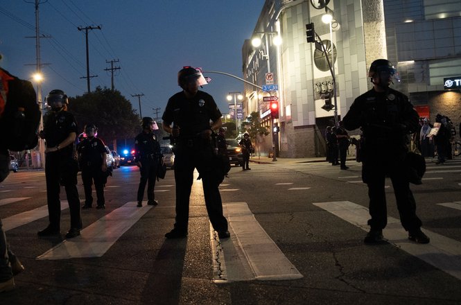 Police officers surround a crowd of demonstrators and press in downtown Los Angeles, California, on June 9, 2025. Freelance photojournalist Alex Brittenham was among those detained and later released without charges.