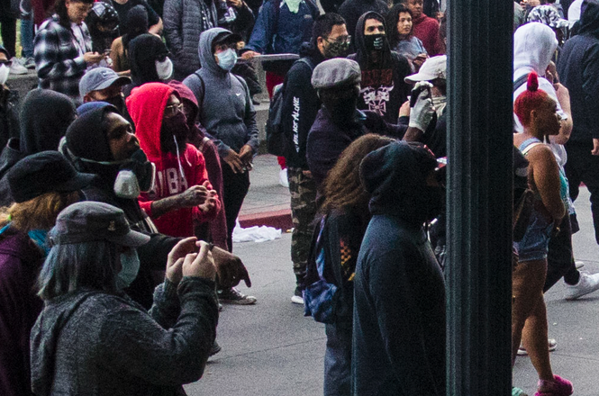 This Is Reno reporter Don Dike-Anukam, center, with hat and white gloves, films just before being assaulted by multiple individuals on May 30, 2020 near City Hall in Reno, Nevada. (THIS IS RENO/TY O'NEIL) Dike-Anukam_assault by Ty O'Neil This Is Reno.png