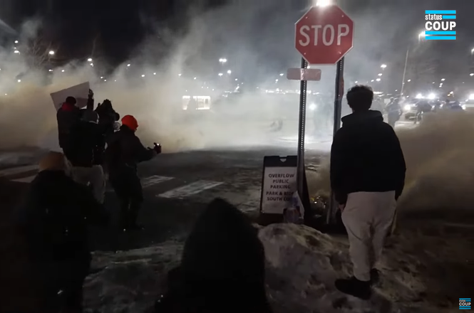 Status Coup photojournalist Jon Farina filmed the scene above as federal agents deployed tear gas at protesters outside the Whipple Federal Building in Fort Snelling, Minnesota, on Jan. 11, 2026. Moments later, he was struck with a crowd-control munition.