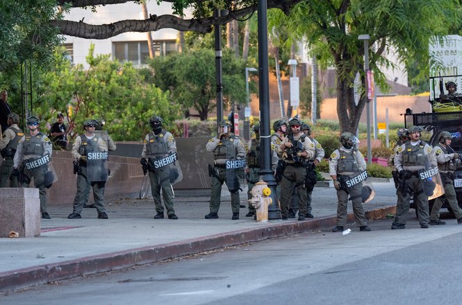 Los Angeles County Sheriff’s deputies form a line as they respond to protests in downtown LA on June 11, 2025. Moments after capturing this photo, photojournalist Jen Golbeck was shot with multiple pepper ball munitions.
