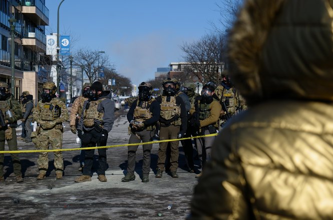 Federal agents face protesters after the killing of Alex Pretti in Minneapolis, Minnesota, on Jan. 24, 2026