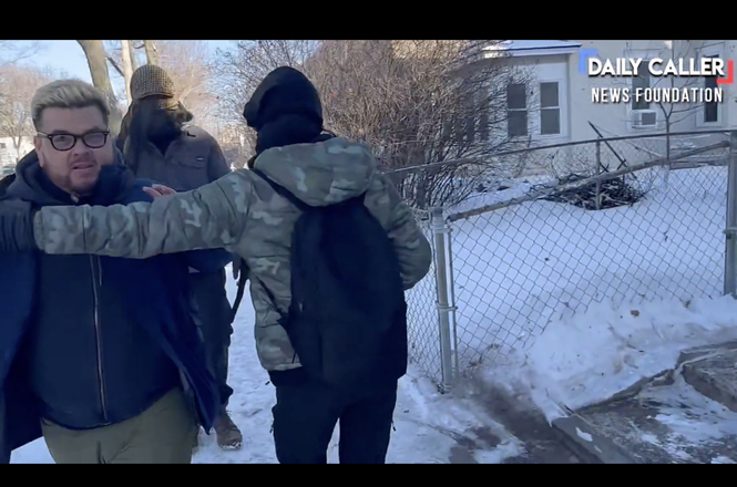 Independent photojournalist Erik Herrera, left, was repeatedly pushed and harassed by individuals in south Minneapolis, Minnesota, on Feb. 2, 2026, while reporting on a makeshift checkpoint intended to thwart immigration operations in the area.