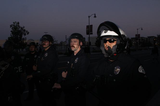 Police officers kettle a group of mostly press, including photographer Steven Berumen, during a workers’ rights and immigration protest on May 1, 2026, in Los Angeles, California.