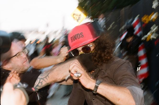 The moment Jonny Morales, behind the camera, is punched by a far-right activist, at center in red hat, at an immigration protest in Los Angeles, California, on June 6, 2026.
