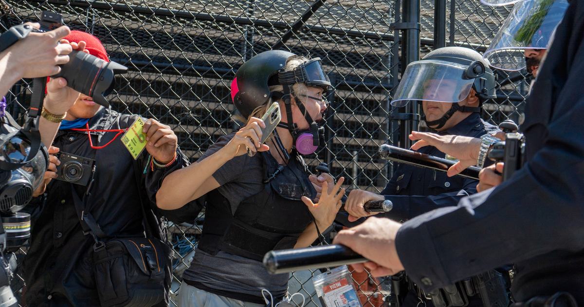 Reporter pushed by police while covering LA immigration protest - U.S ...