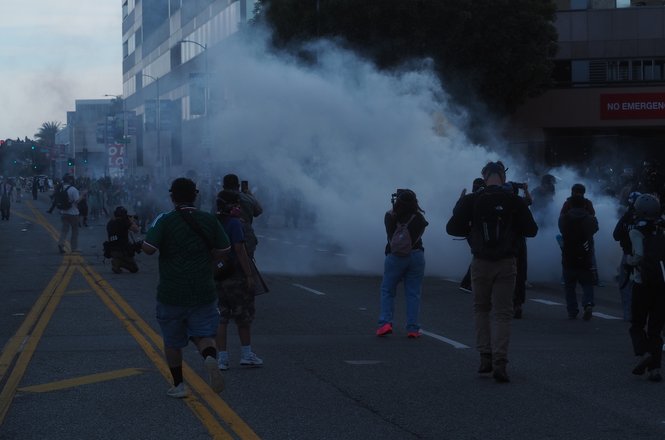 Journalists document a protest near a federal building in Los Angeles on March 28, 2026