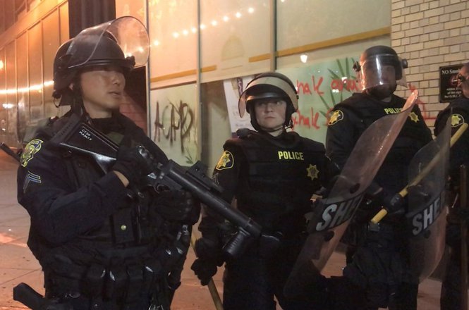 Journalist Sarah Belle Lin said when she asked these officers for the identity of who shot her while her press credentials were visible that she did not receive any response. (COURTESY SARAH BELLE LIN) Lin_assault_0530_Floyd.jpg