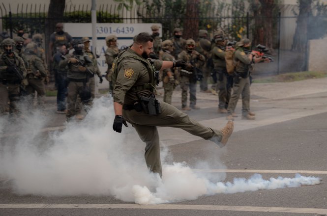 Law enforcement gather at a protest near the cities of Compton and Paramount in California on June 7, 2025. Student photojournalist Jake Crandall was hit with crowd-control munitions while documenting it.