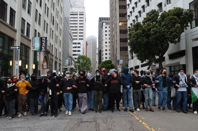 Demonstrators march toward an Immigration and Customs Enforcement building in San Francisco on June 8, 2025. Student journalist Aarya Mukherjee was thrown to the ground and later detained by police while covering the anti-deportation protests.