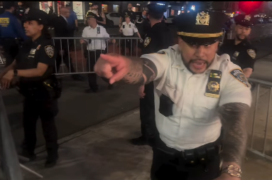 Officers use metal barricades to surround a group of press covering a pro-Palestinian protest in New York City on May 5, 2026