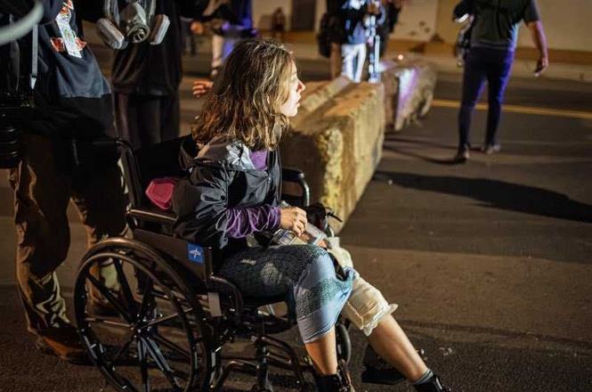 Photojournalist Angelina Katsanis, pictured, was struck in the knee with a wooden board while documenting a protest outside an immigration detention center in Newark, New Jersey, on May 30, 2026.
