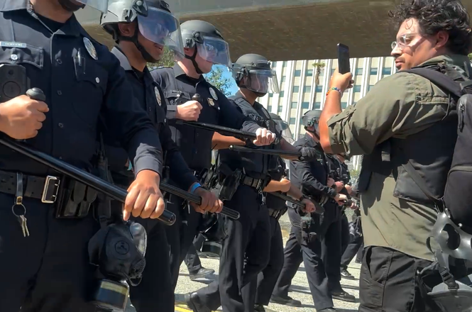 Police push press back at an immigration protest in Los Angeles, California, on April 11, 2026