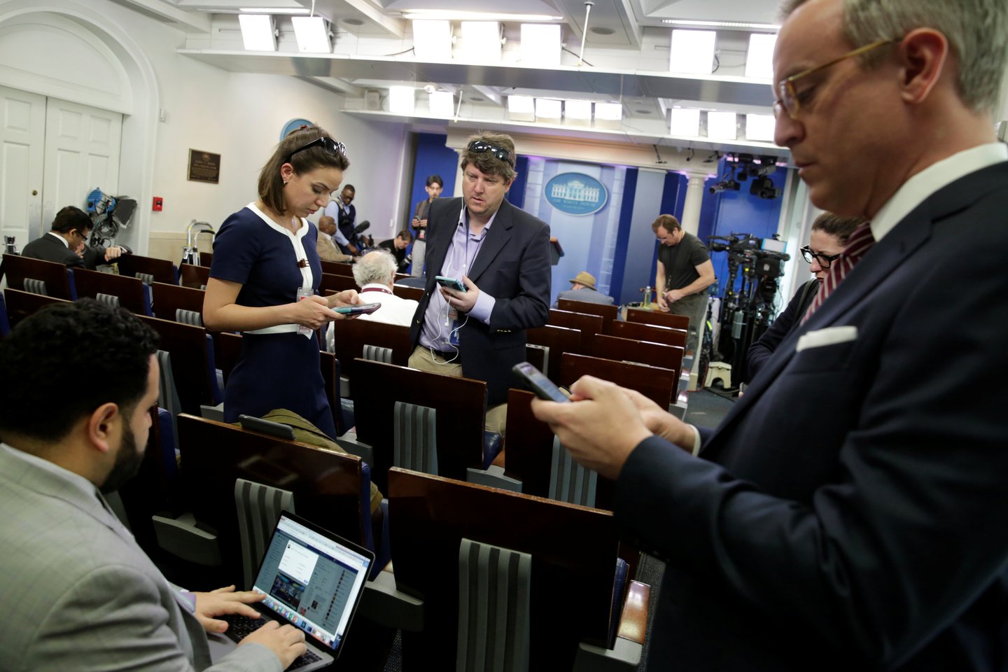 Journalists work in the briefing room at the White House in Washington, U.S., February 24, 2017. Several major news organizations including CNN, The New York Times and Politico were excluded from an off camera "gaggle" meeting with White House Press Secre