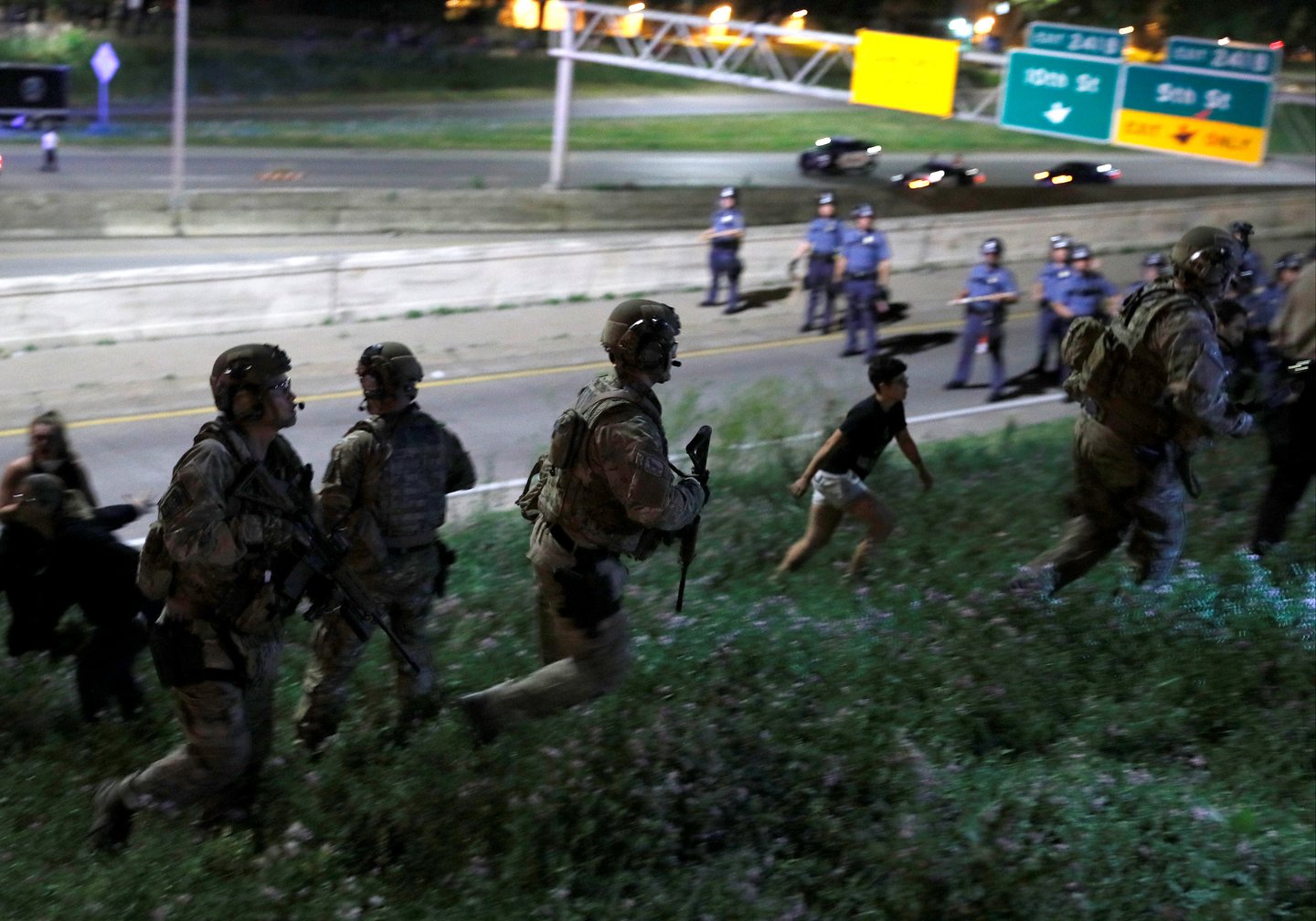 SWAT (Special Weapons and Tactics) teams move to arrest protesters during a gathering on Interstate 94 after a jury found St. Anthony Police Department officer Jeronimo Yanez not guilty of second-degree manslaughter in the death of Philando Castile, at th
