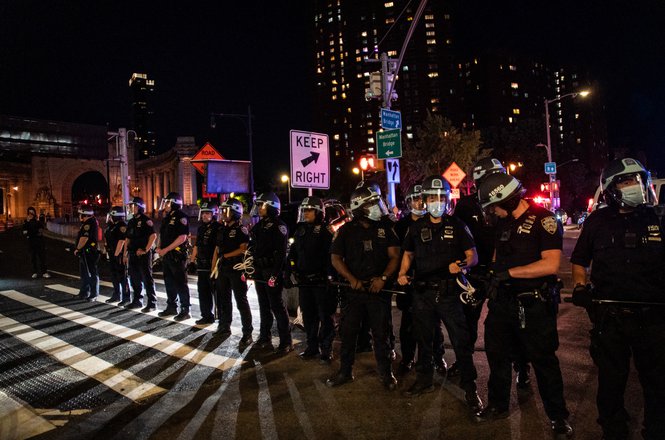 NYPD officers form a line near the Manhattan Bridge in the Manhattan borough of New York City on May 31, 2020. (REUTERS/JEENAH MOON) Blint-Welsh_assault_0531_NY_Floyd.JPG