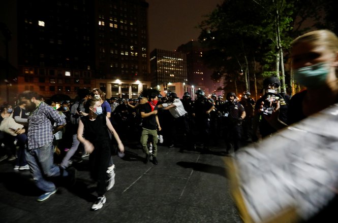 Reuters said photographer Brendan McDermid was knocked down and hit with a baton by a New York Police Department officer while he was on assignment capturing this image and others during a protest in Brooklyn on June 3, 2020. (REUTERS/BRENDAN MCDERMID) McDermid_assault_0603_NY.JPG