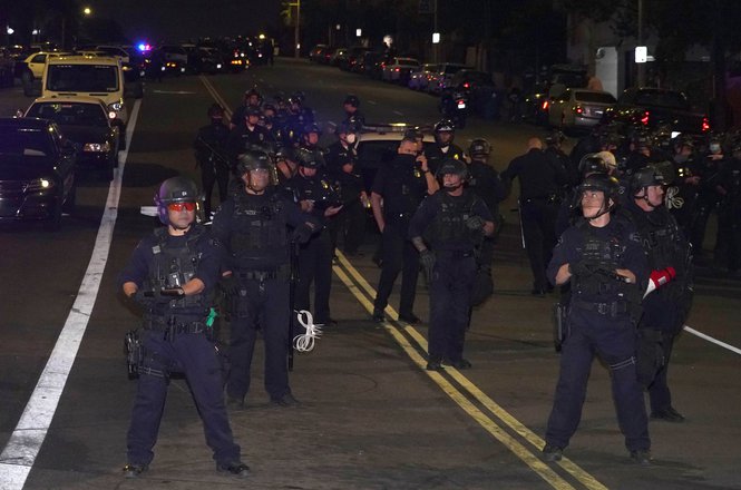 Los Angeles Police Department officers in riot gear stand guard near Dodger Stadium on Oct. 28, 2020, following the Los Angeles Dodgers’ World Series win. (KIRBY LEE-USA TODAY SPORTS VIA REUTERS) Ray_assault_102820.JPG