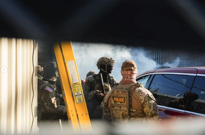 Federal agents at a U.S. Immigration and Customs Enforcement protest in Broadview, Illinois, on Sept. 27, 2025.