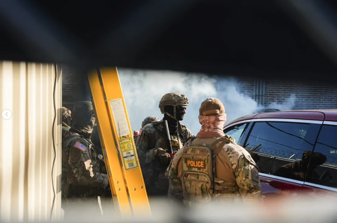 Federal agents at a U.S. Immigration and Customs Enforcement protest in Broadview, Illinois, on Sept. 27, 2025.