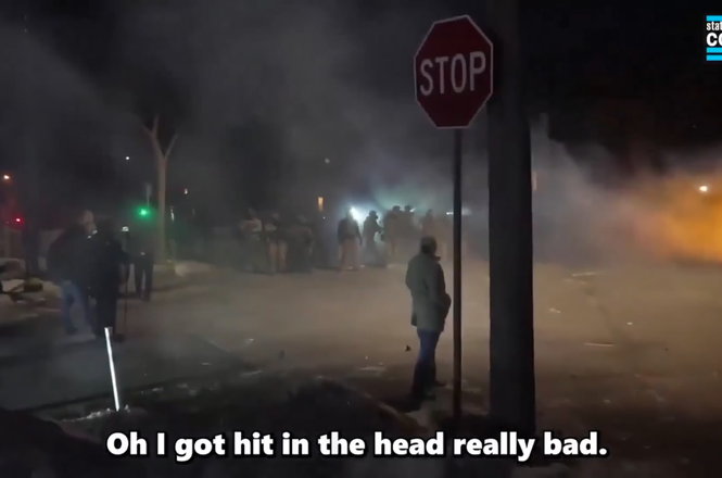 A video frame grab captures the moment just after photographer Zach Roberts was struck with an impact projectile while filming an immigration protest in Minneapolis, Minnesota, on Jan. 14, 2026.