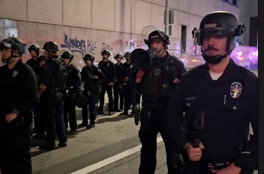 The Los Angeles Police Department announcing imminent arrests at an immigration protest in Los Angeles, California, on Jan. 31, 2026.
