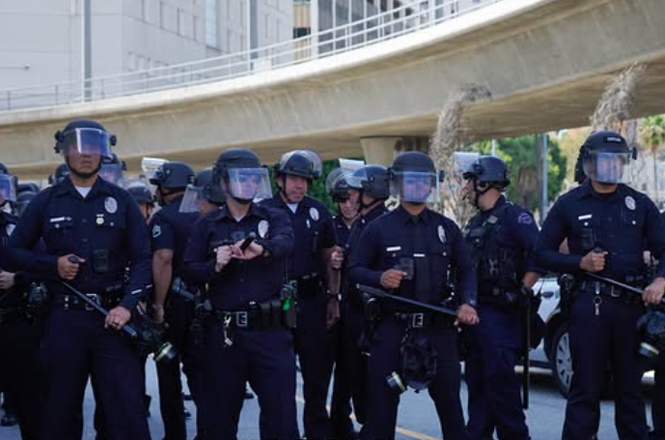 Police respond to a protest against immigration raids in Los Angeles, California, on April 11, 2026.