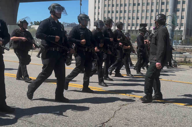 Police push press back at an immigration protest in Los Angeles, California, on April 11, 2026