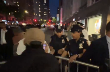 Officers set up metal barricades around a group of press covering a pro-Palestinian protest in New York City on May 5, 2026