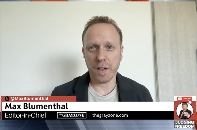 Reporter Max Blumenthal, seen above on the video podcast “Judging Freedom,” was stopped for secondary screening at Dulles International Airport in Virginia on Feb. 24, 2026, by a customs official who referenced an appearance of his on the show.
