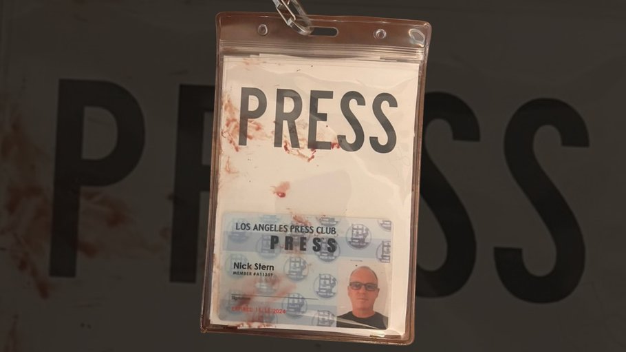 Nick Stern press pass with blood on it