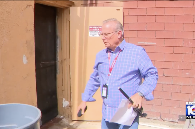 WPLG investigative reporter Jeff Weinsier retrieves parts of the microphone ripped from his hands by a restaurant employee in Hialeah, Florida, while reporting on health violations there on July 17, 2025.