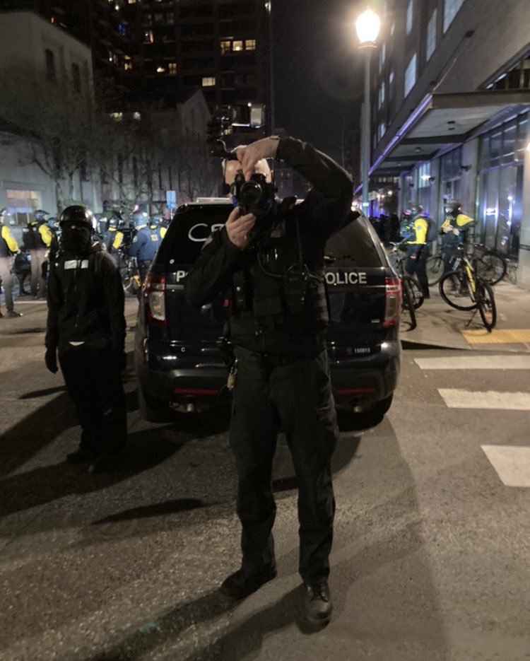 Law enforcement agencies photograph journalists and their IDs as they ...